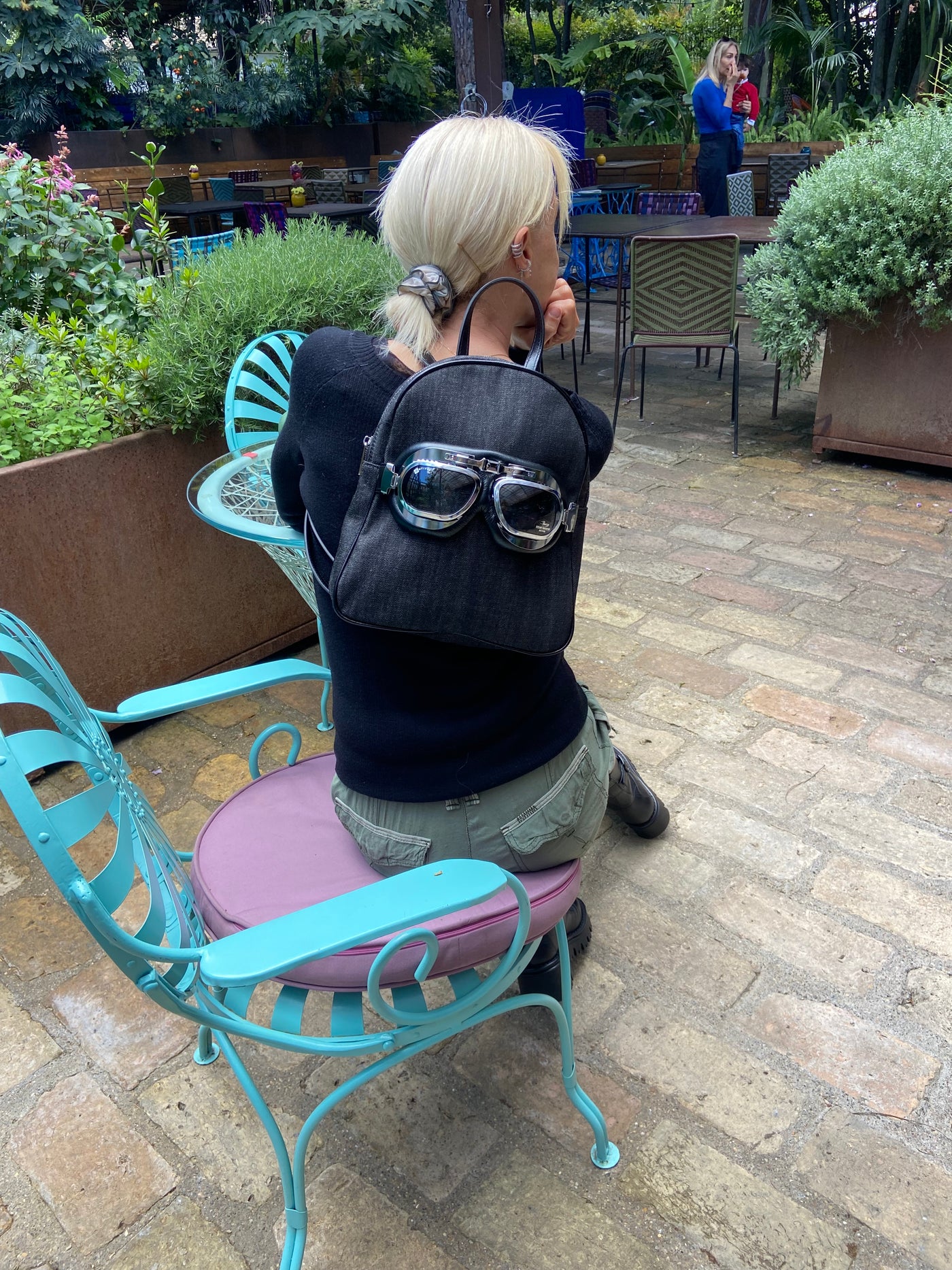 Small denim backpack with glasses