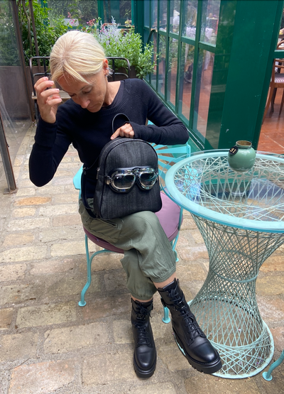 Small denim backpack with glasses